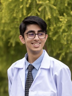 A doctor Rasheed in front of the trees